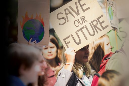people-protesting-with-save-our-future-earth-burning-placards