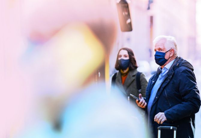 Public transport commuters in face masks