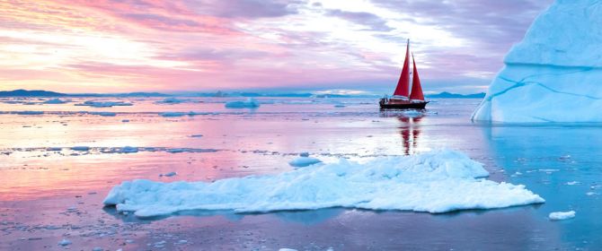 Red boat on icy waters