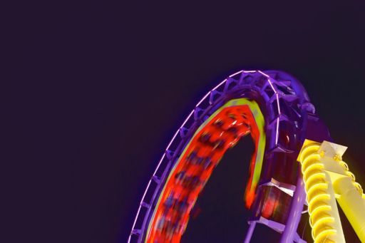 Roller coaster lit up at night