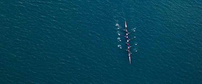 Rowing team at sea