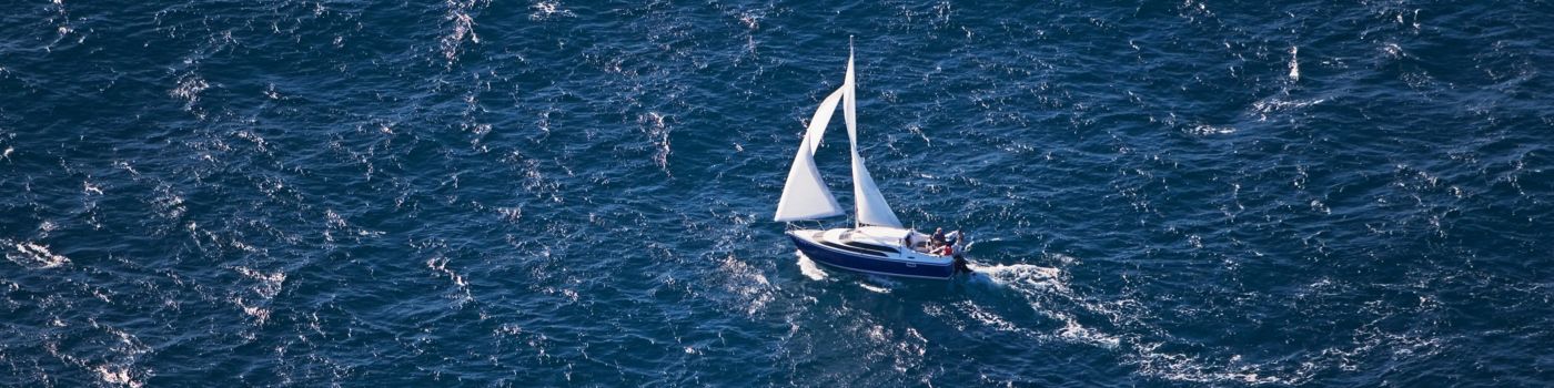 Sailboat in blue ocean