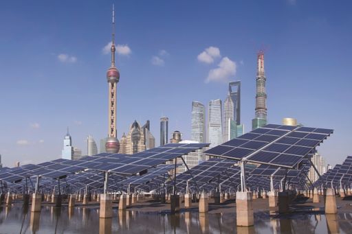 Solar panels against backdrop of Shanghai