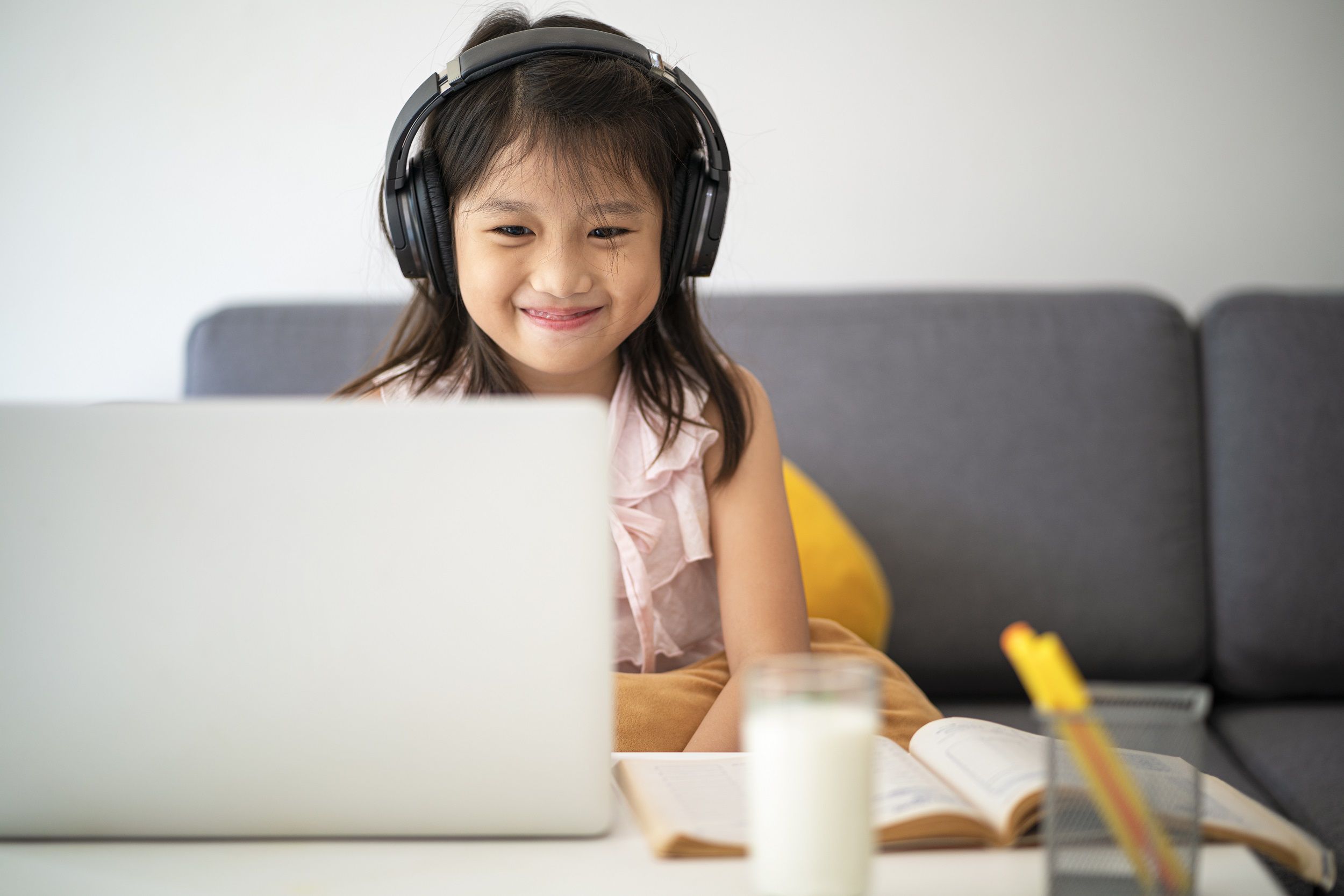 Small girl wearing headphones