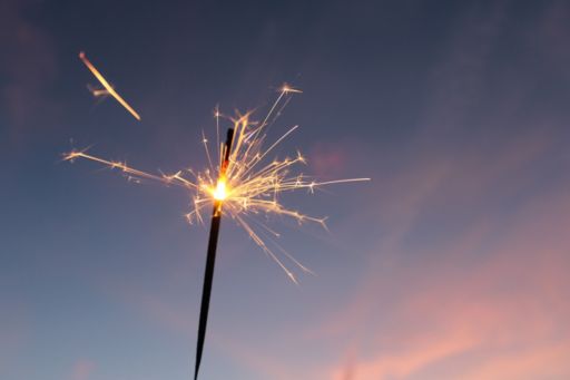 Sparkling fire cracker in evening background