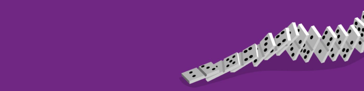 Stack of dices against purple background