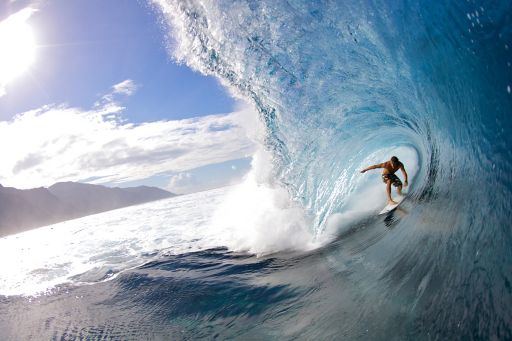 Surfer over sea waves
