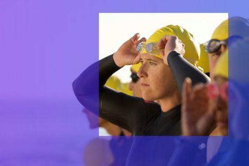 swimmer with yellow cap and diving goggles