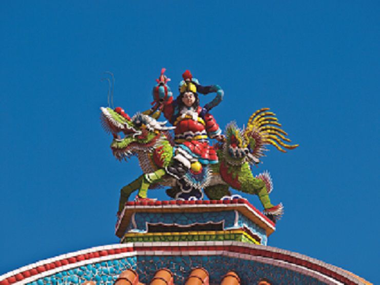 Ornate statue on a Colorful Buddhist temple