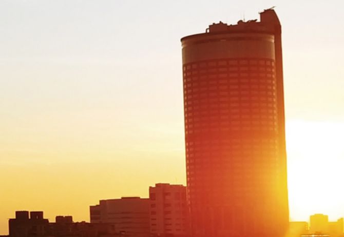 tall circular building at dawn