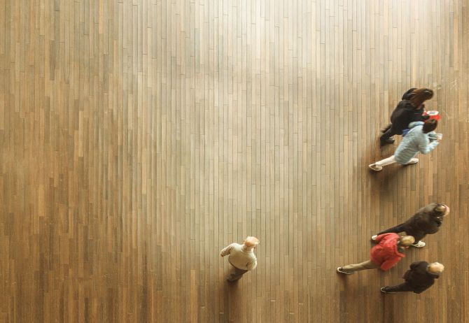Top view of people working on wooden floor