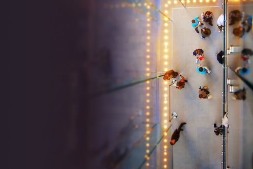 Top view of people in a hallway with lights