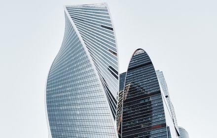 Two abstract shape glass building together