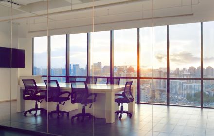 View of office conference room with sunset light in windows