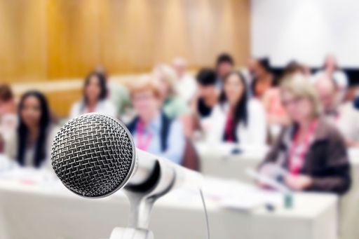 KPMG IFRS breaking news image: microphone in front of audience