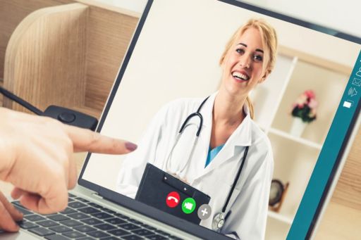 woman having a online digital meeting with doctor