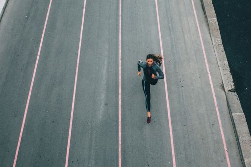 Woman running on a track