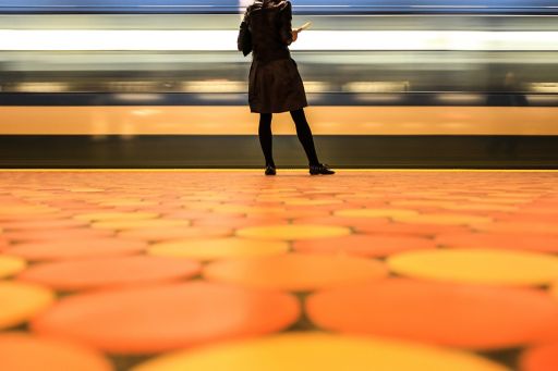 woman standing on subway platform