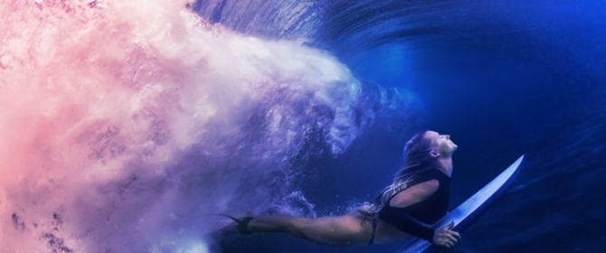 woman surfing underwater